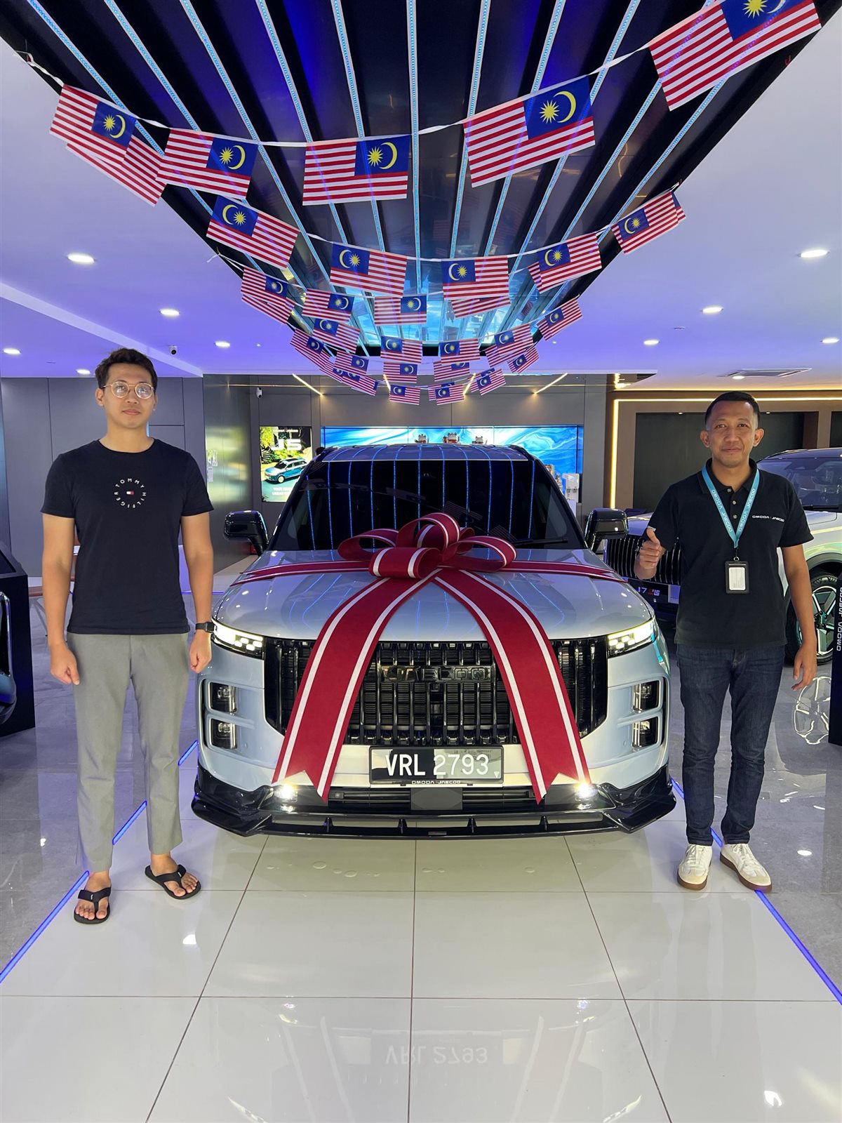 Customer receiving a new vehicle with Aiman